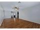 Large living room with wood flooring and plenty of natural light at 7715 S 69Th Ln, Laveen, AZ 85339