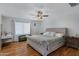 Spacious bedroom with wood floors and a large bed at 7715 S 69Th Ln, Laveen, AZ 85339