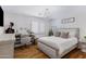 Main bedroom with a vanity and a comfortable bed at 7715 S 69Th Ln, Laveen, AZ 85339