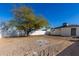 Large backyard with dirt and a white fence at 5816 S 7Th St, Phoenix, AZ 85040