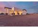 Beautiful stucco home with covered patio and desert landscaping at 22611 W Patton Rd, Wittmann, AZ 85361