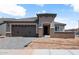 New modern home with a two car garage and neutral color palette at 26997 W Lone Cactus Dr, Buckeye, AZ 85396