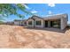 Back exterior view of the home showcasing a patio and desert landscaping at 21493 N 269Th Ave, Buckeye, AZ 85396