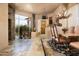 Spacious dining room with stone floors and large windows at 10626 E Palo Brea Dr, Scottsdale, AZ 85262