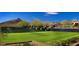 Landscaped tennis court with mountain views at 10626 E Palo Brea Dr, Scottsdale, AZ 85262