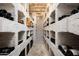 Impressive wine cellar with brick walls and ample storage at 10626 E Palo Brea Dr, Scottsdale, AZ 85262