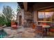 Stone patio with built-in grill and outdoor seating at 10626 E Palo Brea Dr, Scottsdale, AZ 85262