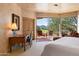 Bedroom with mountain views and private access to patio at 10626 E Palo Brea Dr, Scottsdale, AZ 85262