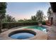 Relaxing pool and spa area with desert landscaping at 10626 E Palo Brea Dr, Scottsdale, AZ 85262