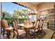 Open dining area with rustic wooden table and chairs at 10626 E Palo Brea Dr, Scottsdale, AZ 85262