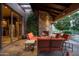 Outdoor patio with fireplace and comfortable seating at 10626 E Palo Brea Dr, Scottsdale, AZ 85262
