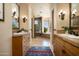 Elegant bathroom with double vanities and a large shower at 10626 E Palo Brea Dr, Scottsdale, AZ 85262