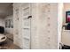 White-washed brick storage room with wooden door at 10626 E Palo Brea Dr, Scottsdale, AZ 85262