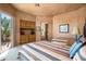 Two twin beds in a spacious bedroom with built-in storage at 10626 E Palo Brea Dr, Scottsdale, AZ 85262