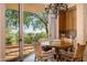 Charming breakfast nook with wood table and chairs, and scenic views at 10626 E Palo Brea Dr, Scottsdale, AZ 85262