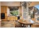 Bright breakfast nook with wood table, chairs, and outdoor access at 10626 E Palo Brea Dr, Scottsdale, AZ 85262