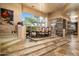 Elegant dining room with stone floors and antler chandelier at 10626 E Palo Brea Dr, Scottsdale, AZ 85262
