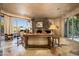 Living room with stone fireplace and large windows at 10626 E Palo Brea Dr, Scottsdale, AZ 85262