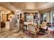 Open concept living area with stone pillars and ample natural light at 10626 E Palo Brea Dr, Scottsdale, AZ 85262