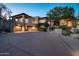 Luxury home with stone accents and a large driveway at 10626 E Palo Brea Dr, Scottsdale, AZ 85262