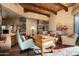 Spacious home office features a large wood desk, comfortable seating, and high ceilings at 10626 E Palo Brea Dr, Scottsdale, AZ 85262