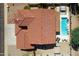 Home with a terracotta tile roof and a refreshing pool at 161 N Silverwood Dr, Casa Grande, AZ 85122