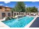 Inviting pool with waterfall feature and spacious patio area at 161 N Silverwood Dr, Casa Grande, AZ 85122