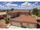 Two-story house with tile roof, three-car garage, and landscaped yard at 161 N Silverwood Dr, Casa Grande, AZ 85122