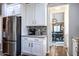 Modern kitchen with white cabinets and stainless steel appliances at 161 N Silverwood Dr, Casa Grande, AZ 85122