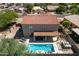 Home with pool, spa, and covered patio; backyard oasis at 161 N Silverwood Dr, Casa Grande, AZ 85122