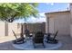 Fire pit area with four rocking chairs, perfect for gatherings at 161 N Silverwood Dr, Casa Grande, AZ 85122