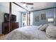Main bedroom with large TV and access to patio at 161 N Silverwood Dr, Casa Grande, AZ 85122
