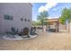 Spacious backyard with fire pit, patio, and pergola at 161 N Silverwood Dr, Casa Grande, AZ 85122