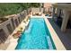 Relaxing rectangular pool with waterfall feature and lounge area at 161 N Silverwood Dr, Casa Grande, AZ 85122