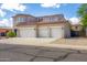 Two-story house with three-car garage and desert landscaping at 161 N Silverwood Dr, Casa Grande, AZ 85122