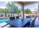 Relaxing pool area with waterfall feature and patio furniture at 161 N Silverwood Dr, Casa Grande, AZ 85122