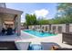 Inviting pool with waterfall feature and spacious patio at 161 N Silverwood Dr, Casa Grande, AZ 85122