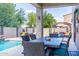 Outdoor patio with dining table and access to pool at 161 N Silverwood Dr, Casa Grande, AZ 85122