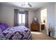 Bright bedroom featuring a double bed, dresser, and ensuite bathroom at 161 N Silverwood Dr, Casa Grande, AZ 85122