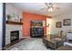 Living room with fireplace, large TV, and comfortable seating at 161 N Silverwood Dr, Casa Grande, AZ 85122