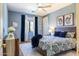 Spacious bedroom with wood bed frame, and blue color scheme at 161 N Silverwood Dr, Casa Grande, AZ 85122