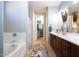 Main bathroom with double vanity and walk-in closet at 161 N Silverwood Dr, Casa Grande, AZ 85122