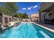 Relaxing pool area with patio furniture and pergola at 161 N Silverwood Dr, Casa Grande, AZ 85122