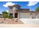 Beautiful two-story home with three-car garage and landscaping at 161 N Silverwood Dr, Casa Grande, AZ 85122