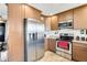 Modern kitchen with stainless steel appliances and ample cabinetry at 817 W Villa Rita Dr, Phoenix, AZ 85023