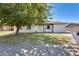 Front view of a charming single-story home with a well-maintained lawn at 817 W Villa Rita Dr, Phoenix, AZ 85023