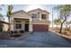 Two-story house with brown garage door and desert landscaping at 3513 S 87Th Dr, Tolleson, AZ 85353