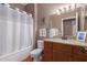 Clean bathroom with granite countertop and a shower/tub combo at 19601 N Papago Dr, Surprise, AZ 85374