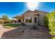 Landscaped backyard with gravel and artificial turf at 19601 N Papago Dr, Surprise, AZ 85374