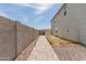 Side yard pathway with block wall and gravel at 36545 N Herens Rd, San Tan Valley, AZ 85143